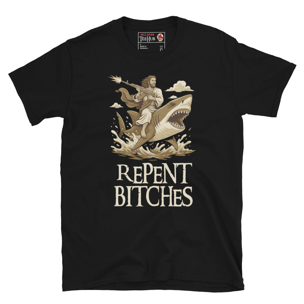Black T-shirt featuring an illustration of Jesus riding a shark and holding a machine gun, with the phrase “Repent Bitches” written below.