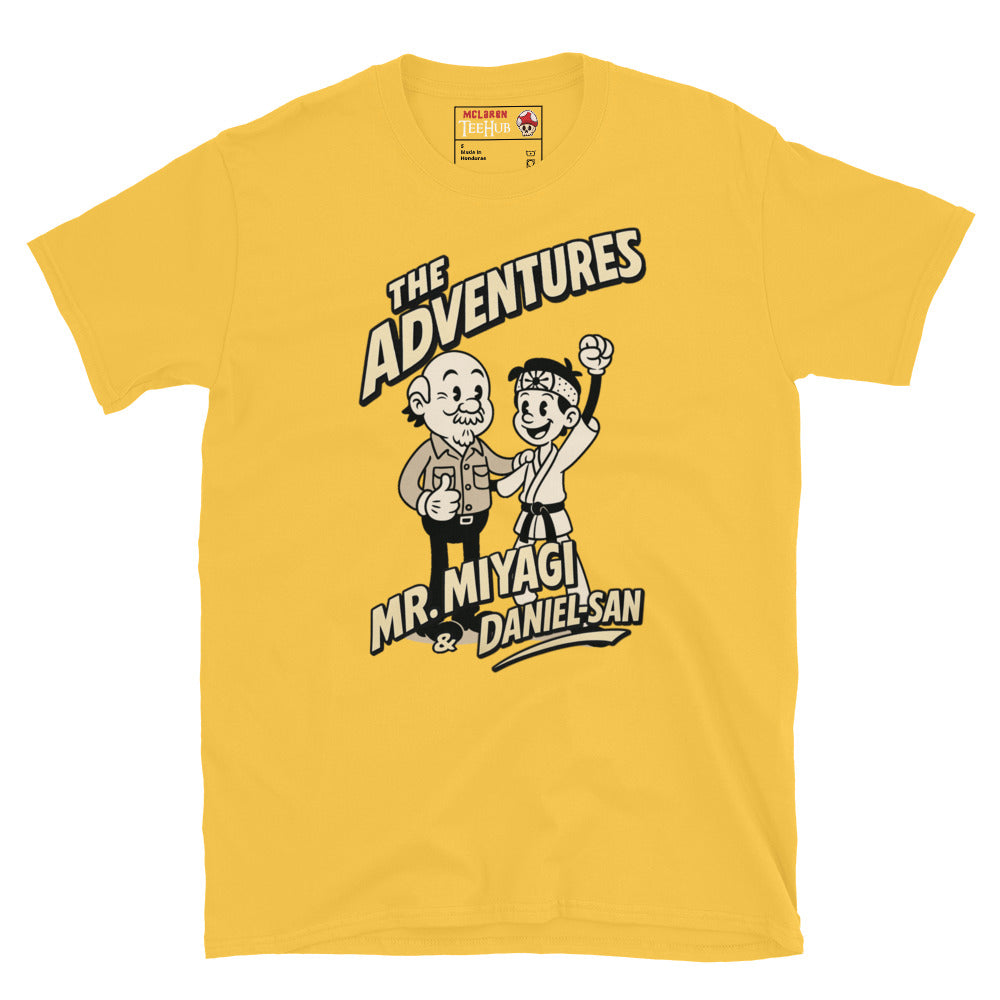 Daisy Yellow T-shirt featuring a vintage cartoon design of Mr. Miyagi and Daniel-San from The Karate Kid, with the text 'The Adventures of Mr. Miyagi & Daniel-San'.
