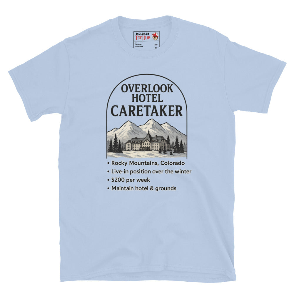 Light blue T-shirt featuring a faux job ad for the Overlook Hotel caretaker position with mountains and hotel graphic, inspired by The Shining.