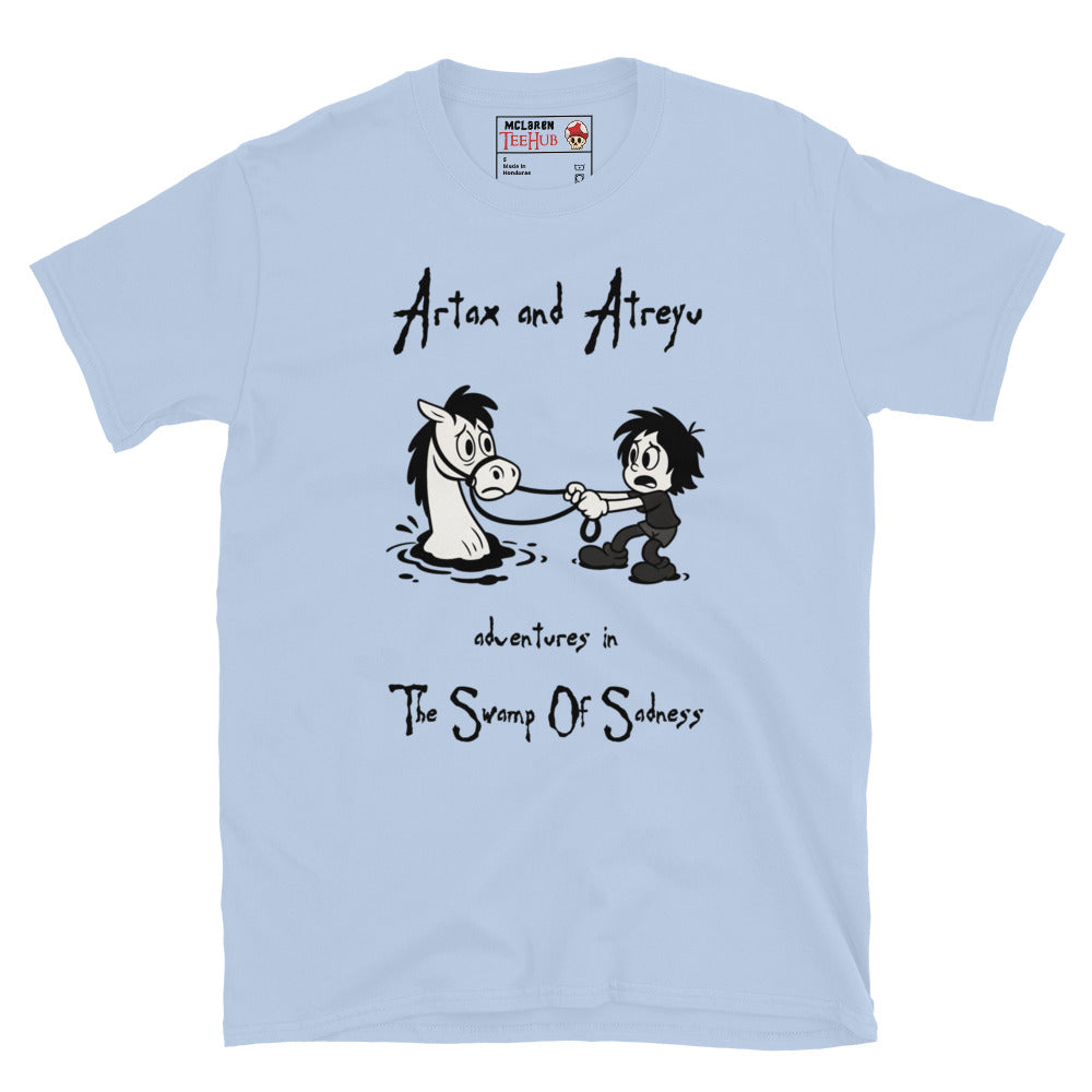 Light Blue Cartoon-style T-shirt featuring Atreyu pulling Artax from the Swamp of Sadness, inspired by The NeverEnding Story, with the text “Adventures in the Swamp of Sadness.”