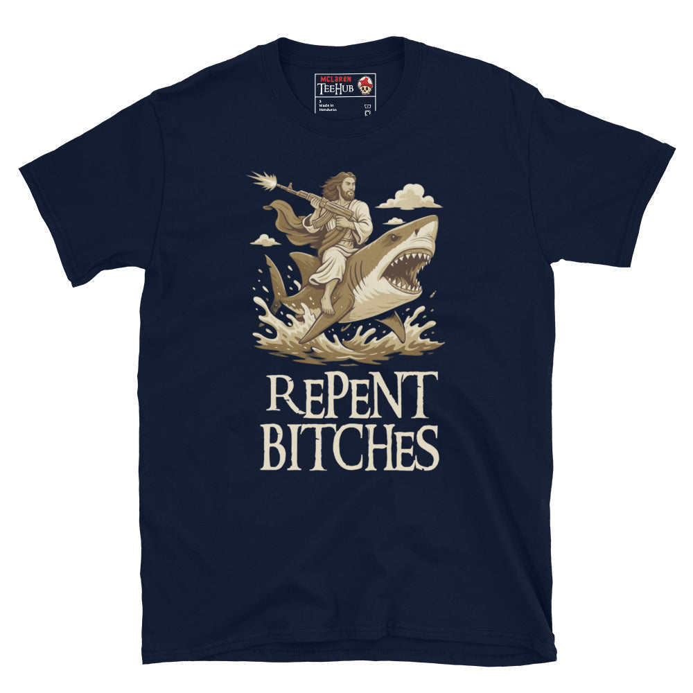 Navy T-shirt featuring an illustration of Jesus riding a shark and holding a machine gun, with the phrase “Repent Bitches” written below.