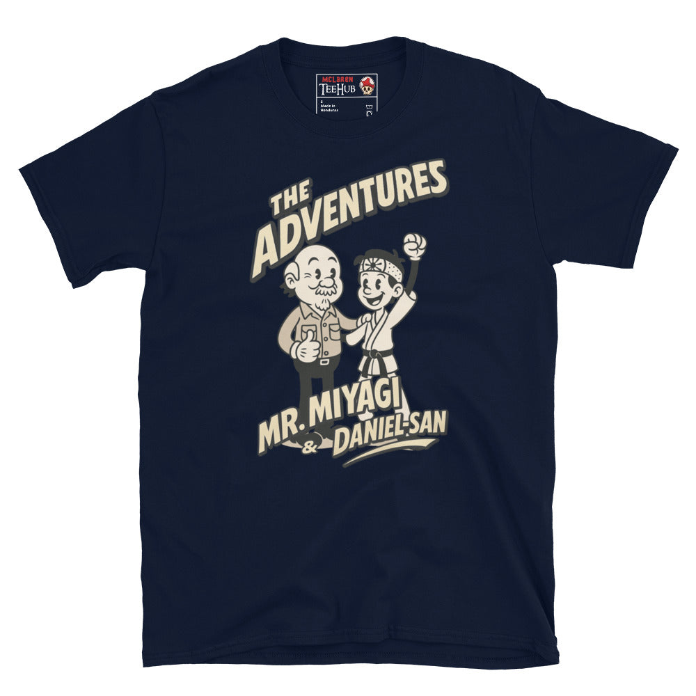 Navy T-shirt featuring a vintage cartoon design of Mr. Miyagi and Daniel-San from The Karate Kid, with the text 'The Adventures of Mr. Miyagi & Daniel-San'.