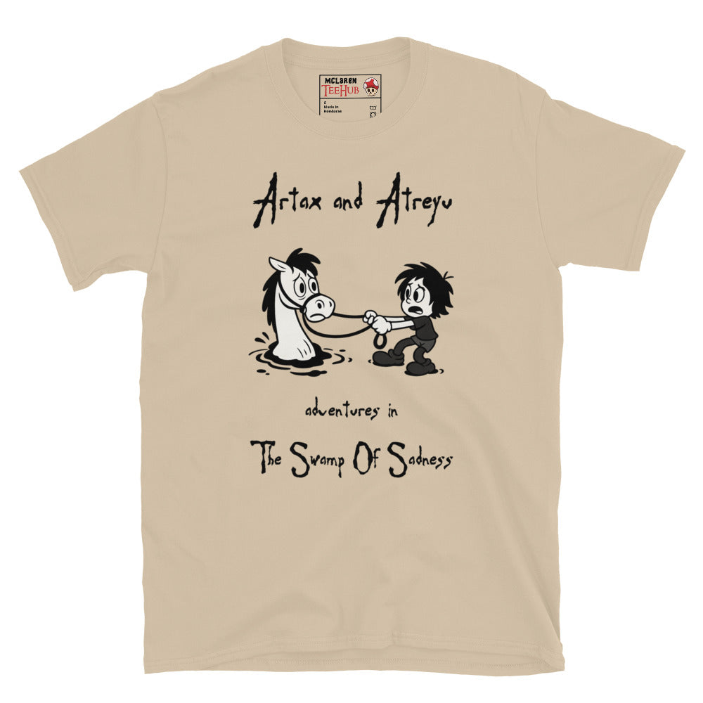 Sand Cartoon-style T-shirt featuring Atreyu pulling Artax from the Swamp of Sadness, inspired by The NeverEnding Story, with the text “Adventures in the Swamp of Sadness.”