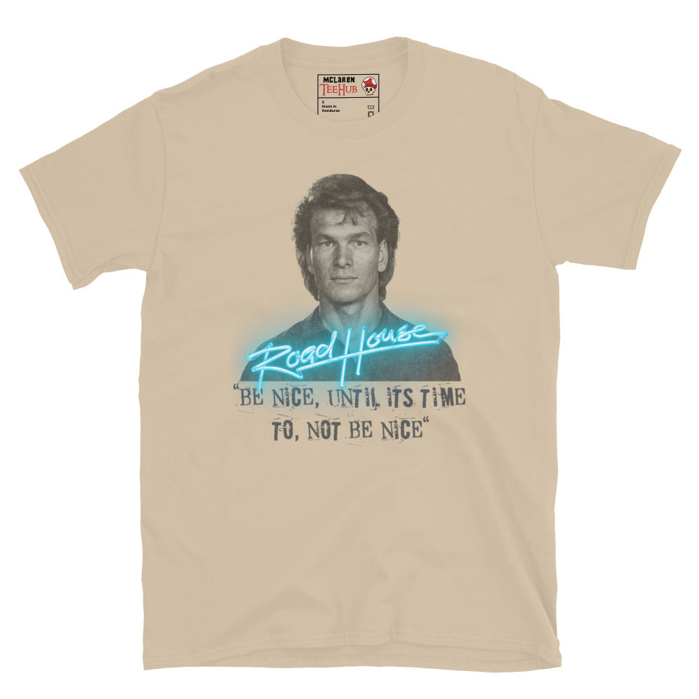 Road House Sand T-shirt featuring Patrick Swayze as Dalton with the quote “Be Nice Until It’s Time to Not Be Nice” in neon style.