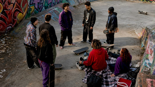 Diverse youth in streetwear at urban street corner