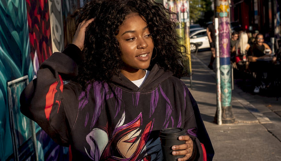 Young woman in vibrant hoodie walking city street