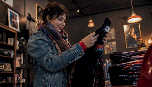 Young woman shopping limited edition film merch