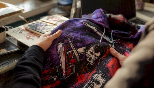 Hands examining printed hoodie sample