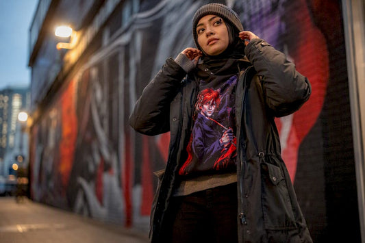 Person layering winter movie merch outfit outdoors