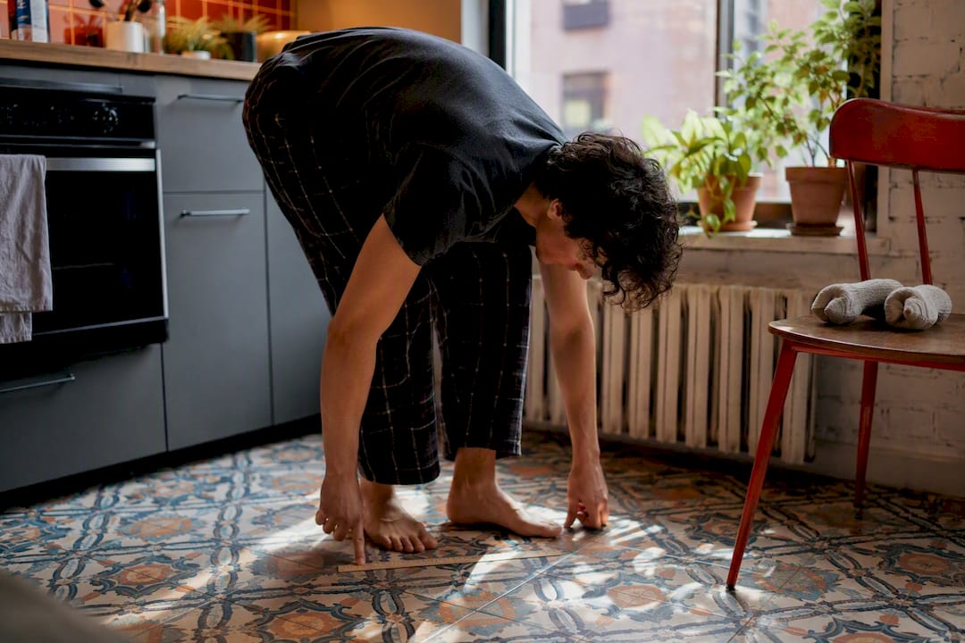 Person measuring foot length with ruler