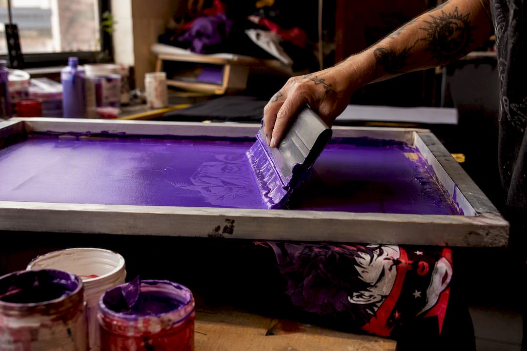 Manual screen printing on fabric close-up