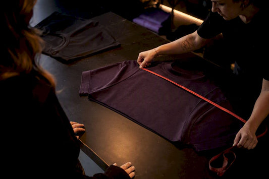 Comparing shirt fit with measuring tape