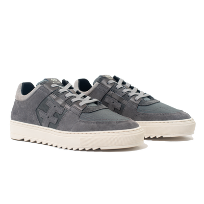 Pair of gray sneakers with white soles on a white background
