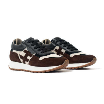 Pair of brown and black sneakers with white sole on a white background