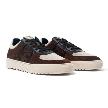 Pair of Brown and black sneakers with white soles on a white background