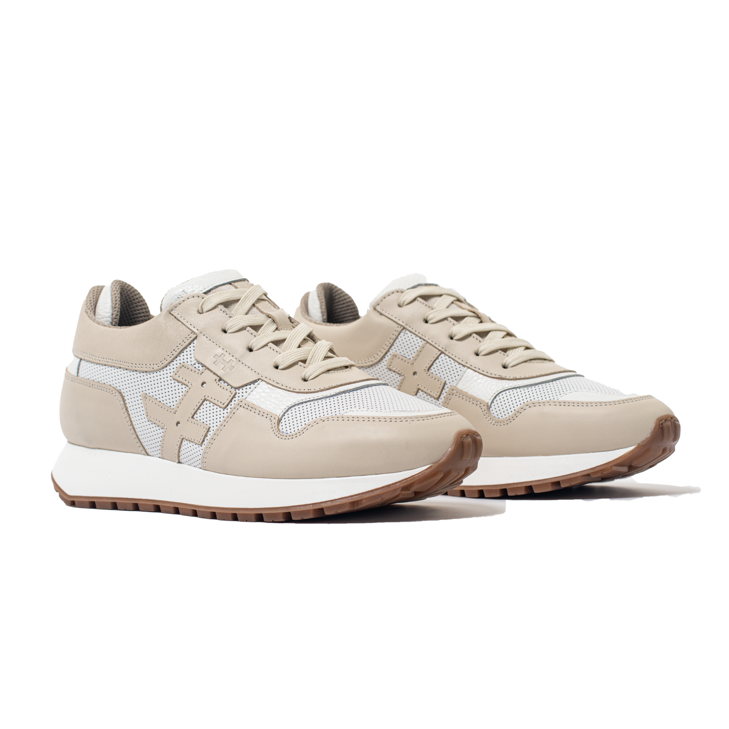 Pair of Beige and white sneakers on a white background