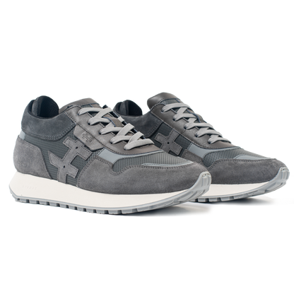 Pair of gray sneakers on a white background