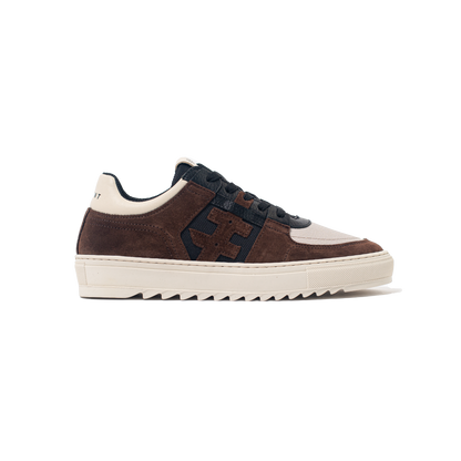 Brown and black sneaker with white sole on a white background