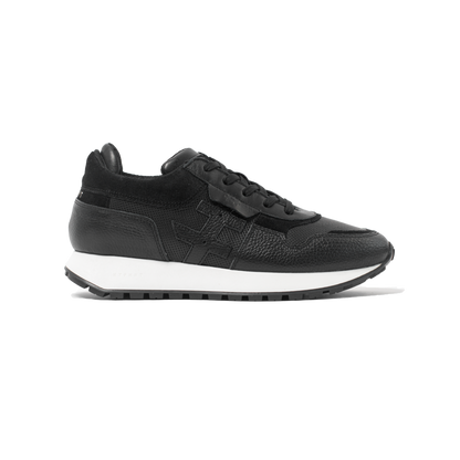 Black sneaker with white sole on a white background