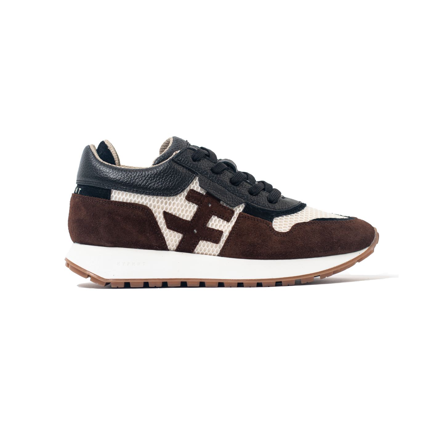 Sneaker with brown, white, and black design on a white background