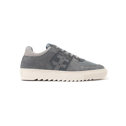 Gray sneaker with a white sole on a white background