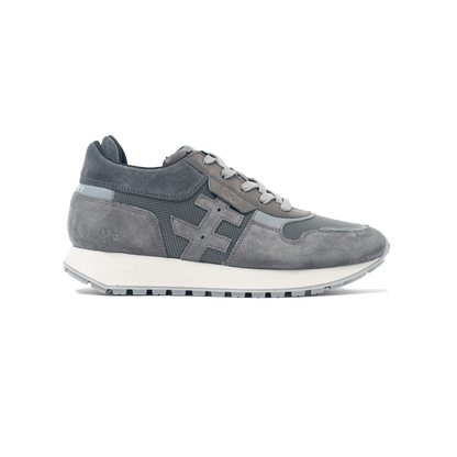 Gray sneaker with a white sole on a white background