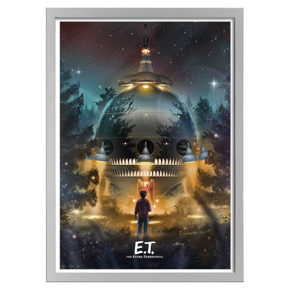 Framed movie poster of E.T. with a spaceship in a forest at night.