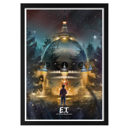 Framed movie poster of E.T. with a spaceship in a forest at night.