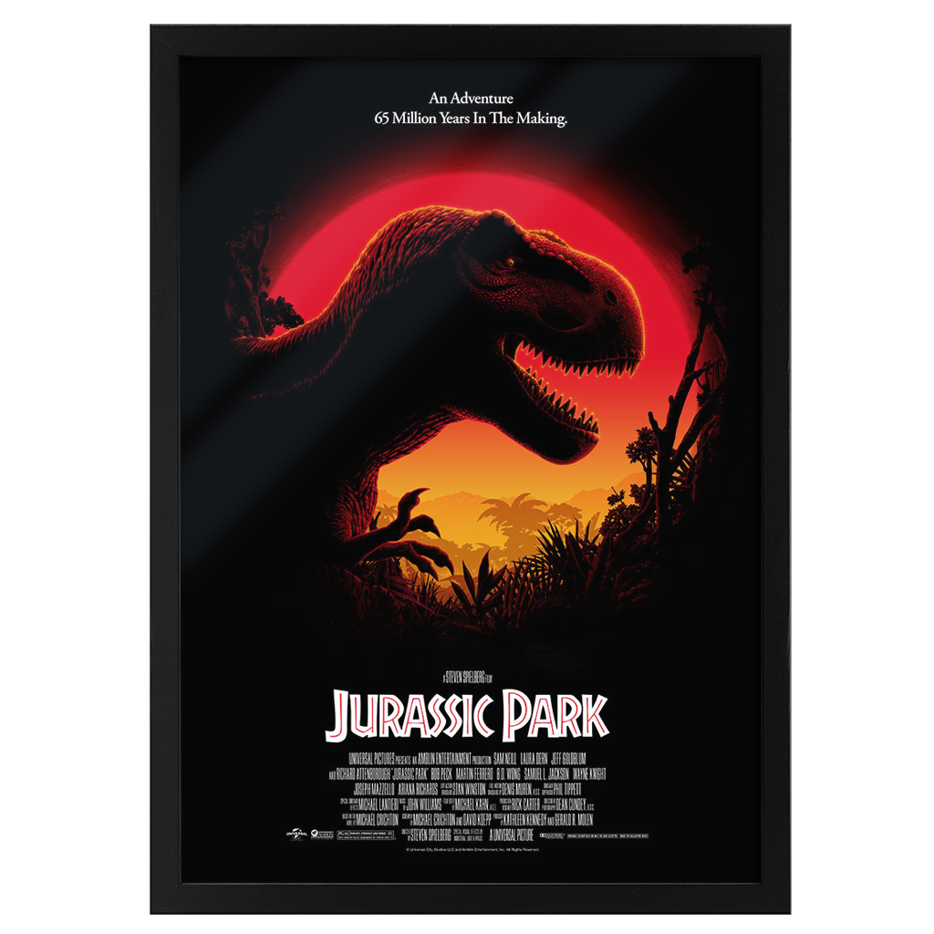 Framed movie poster of 'Jurassic Park' with a silhouette of a dinosaur against a red sky.