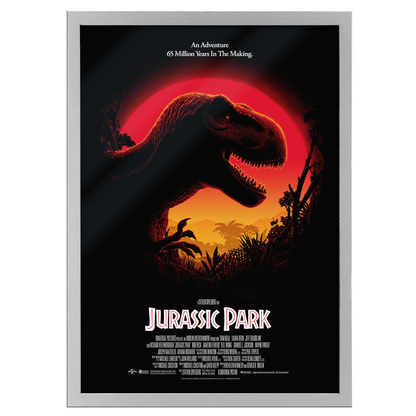 Framed movie poster of 'Jurassic Park' with a dinosaur silhouette against a red sun.