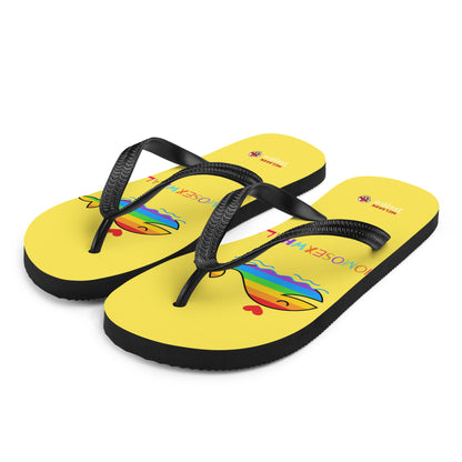 Funny rainbow whale flip flops with bright yellow base and colourful pride-inspired design
