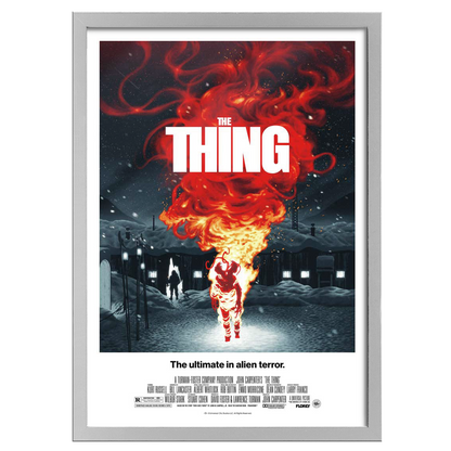 Movie poster for 'The Thing' with a fiery alien figure and snowy landscape.