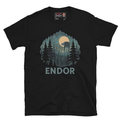 Black T-shirt featuring a forest scene with trees, full moon, and an AT-AT silhouette, with the word “Endor” below – inspired by Star Wars.