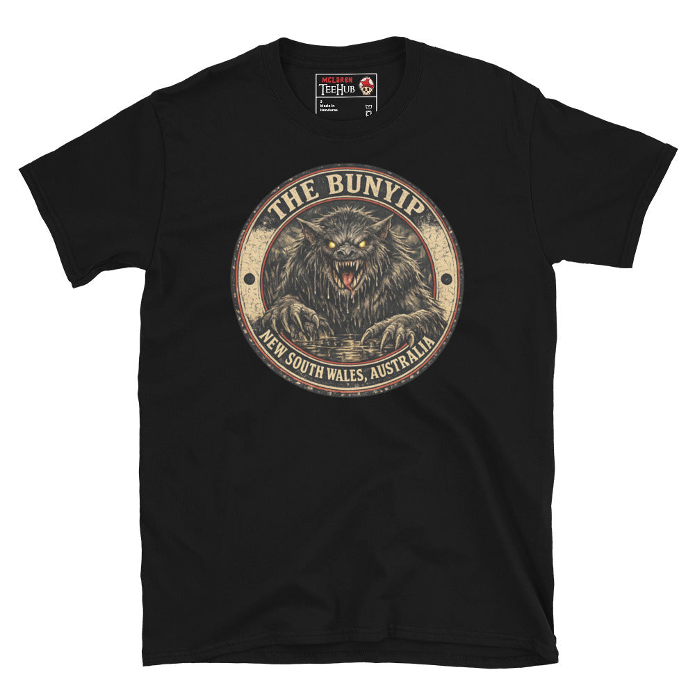 Black Bunyip New South Wales Australia t-shirt with vintage distressed badge featuring shaggy dark Bunyip rising from water with glowing amber eyes savage fangs and claws.