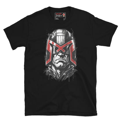 Black Judge Dredd t-shirt with dramatic ink splatter portrait featuring iconic helmet and bold red eagle visor with high contrast black ink sketch detail and splatter accents