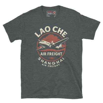 Dark Heather T-shirt featuring a retro prop plane with text “Lao Che Air Freight Shanghai” in a vintage Indiana Jones–style design.

