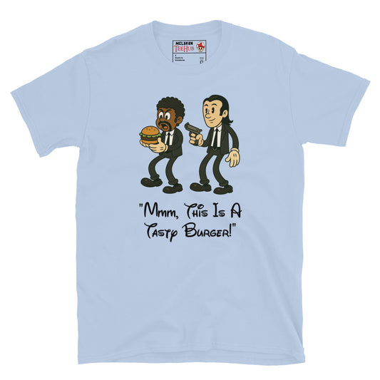 Light blue T-shirt with cartoon characters resembling Jules and Vincent from Pulp Fiction, holding a burger and a gun, with the quote “Mmm, This Is a Tasty Burger!”