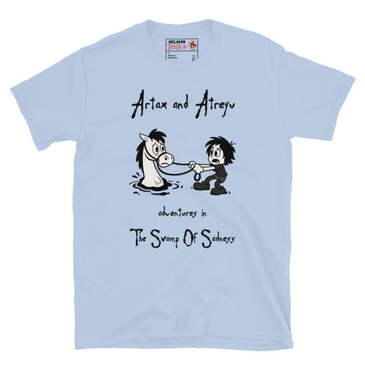 Light Blue Cartoon-style T-shirt featuring Atreyu pulling Artax from the Swamp of Sadness, inspired by The NeverEnding Story, with the text “Adventures in the Swamp of Sadness.” 