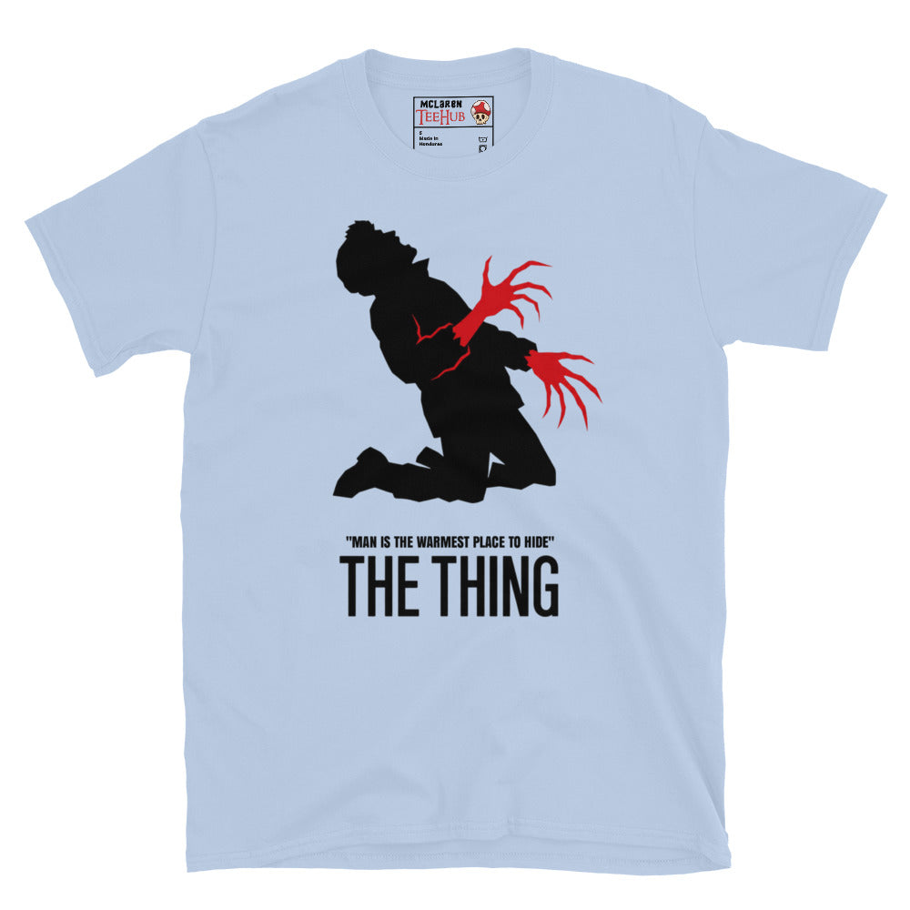 The Thing Bennings transformation t-shirt featuring minimalist horror artwork and the quote Man Is The Warmest Place To Hide. Light Blue