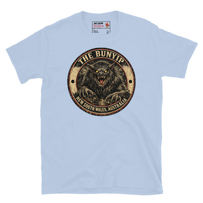 Light Blue Bunyip New South Wales Australia t-shirt with vintage distressed badge featuring shaggy dark Bunyip rising from water with glowing amber eyes savage fangs and claws.