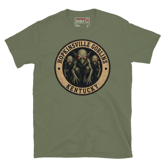 Military Green Hopkinsville Goblins Kentucky t-shirt with vintage distressed badge featuring three alien goblin figures with glowing red eyes and clawed hands lunging forward.