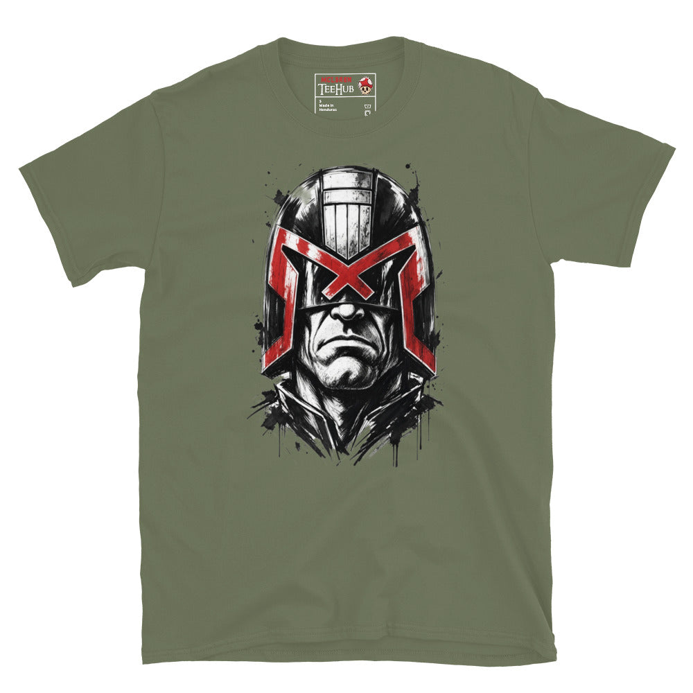 Military Green Judge Dredd t-shirt with dramatic ink splatter portrait featuring iconic helmet and bold red eagle visor with high contrast black ink sketch detail and splatter accents
