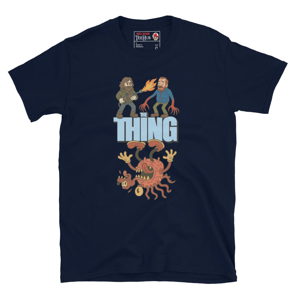 Navy Blue T-shirt with a cartoon parody design of The Thing featuring MacReady with a flamethrower and a mutated creature.