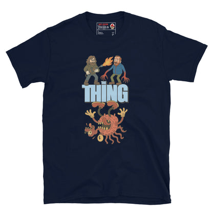 Navy Blue T-shirt with a cartoon parody design of The Thing featuring MacReady with a flamethrower and a mutated creature.