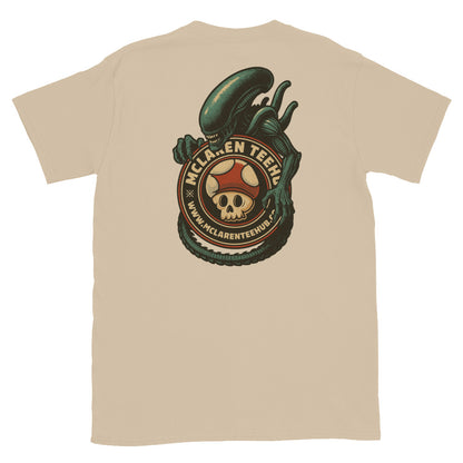 Large graphic on back of Sand T-shirt featuring an alien creature wrapped around the McLaren Tee Hub skull mushroom emblem.
