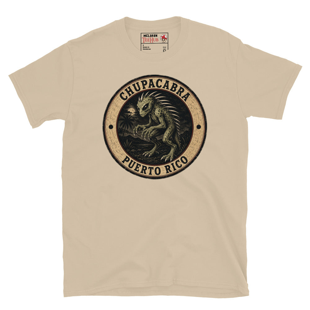 Sand colour Chupacabra Puerto Rico t-shirt with vintage distressed badge featuring original reptilian Chupacabra with scaled body dorsal spines alien eyes and claws in tropical night scene