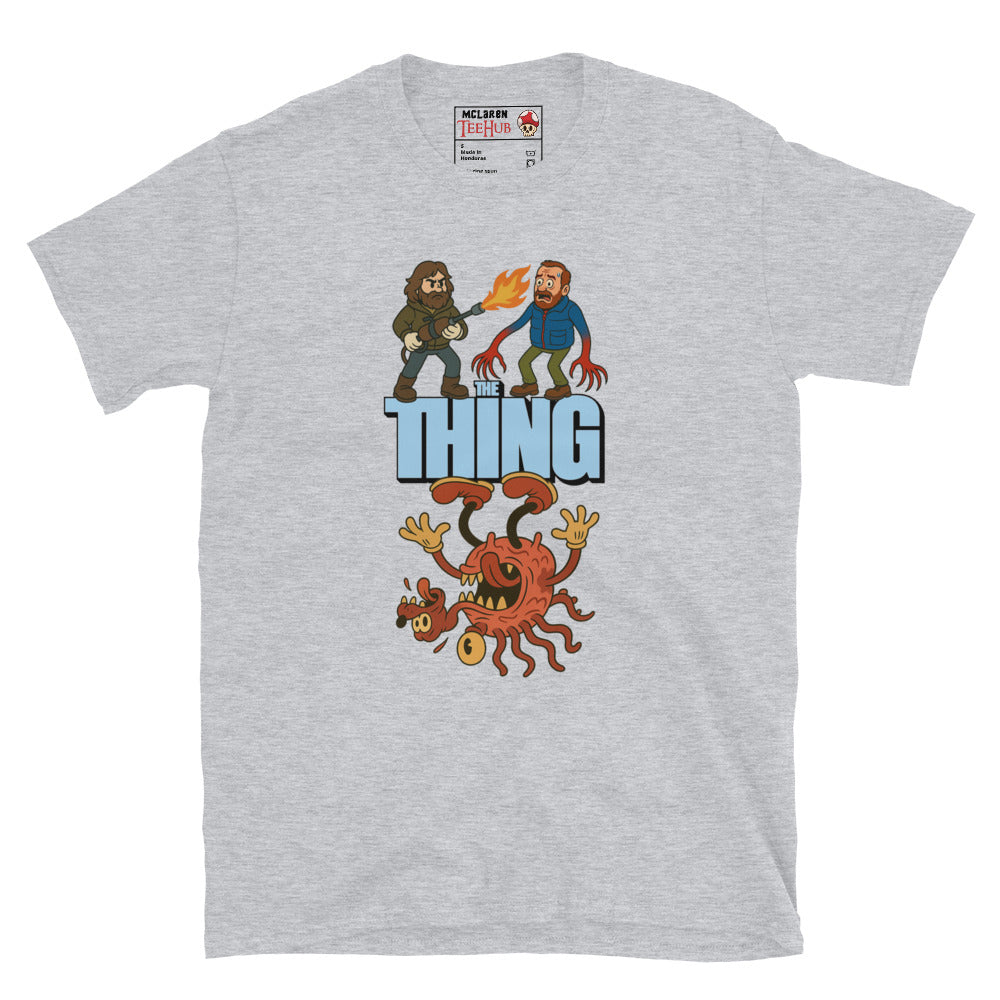 Sport Grey T-shirt with a cartoon parody design of The Thing featuring MacReady with a flamethrower and a mutated creature.